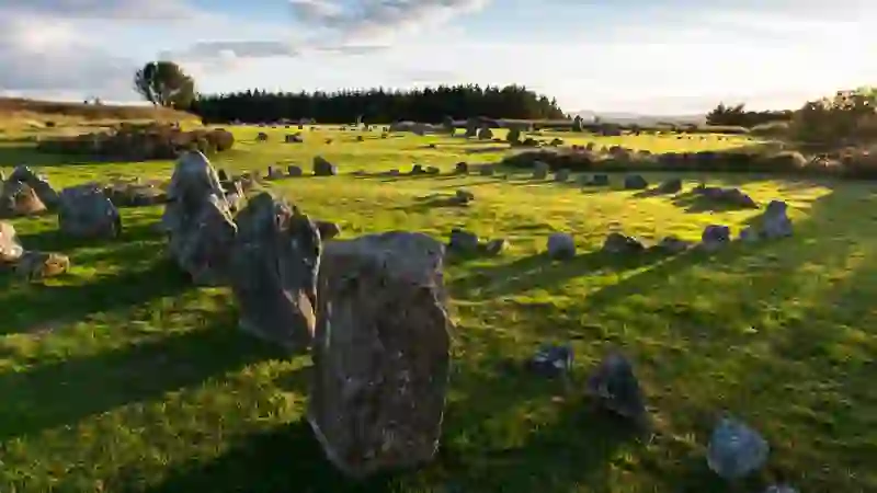 Ancient stone circles at Beaghmore Stone Circles, County Tyrone, in warm evening light.