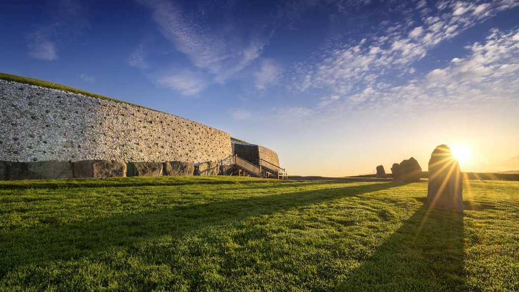 Sunrise over the prehistoric Newgrange passage tomb at Brú na Bóinne in County Meath, Ireland.