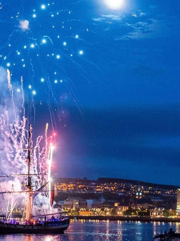 Fireworks display over a tall ship at Foyle Maritime Festival in Derry~Londonderry.