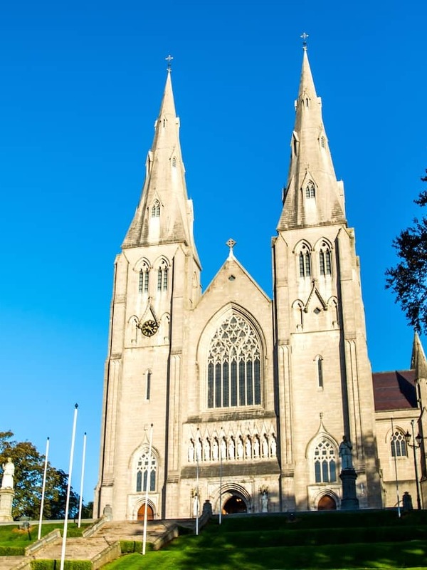 St Patrick’s Roman Catholic Cathedral with twin spires and Gothic facade on a hill in Armagh city, Northern Ireland.