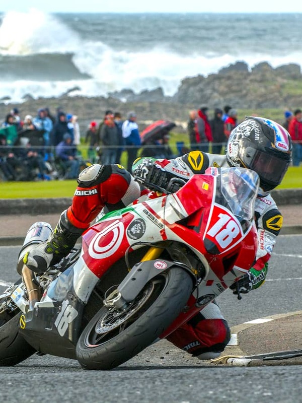 Motorcyclist leaning into a corner during the North West 200 road race on the Causeway Coast, Northern Ireland.