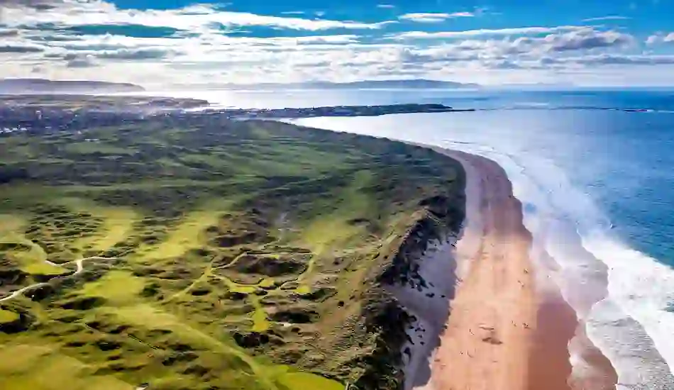 Aerial view of Royal Portrush Golf Club and Whiterocks Beach along the Causeway Coast in County Antrim, Northern Ireland.