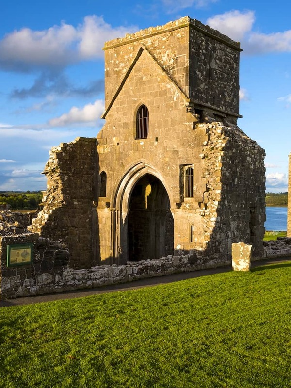 Medieval church ruins and round tower on Devenish Island overlooking Lough Erne in County Fermanagh, Northern Ireland.