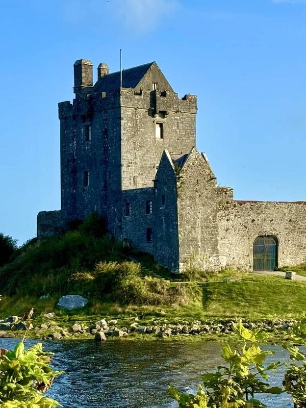 Medieval Dunguaire Castle standing beside the water near Kinvara in County Galway.