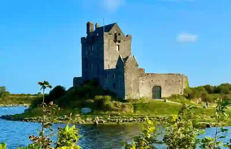 Medieval Dunguaire Castle standing beside the water near Kinvara in County Galway.