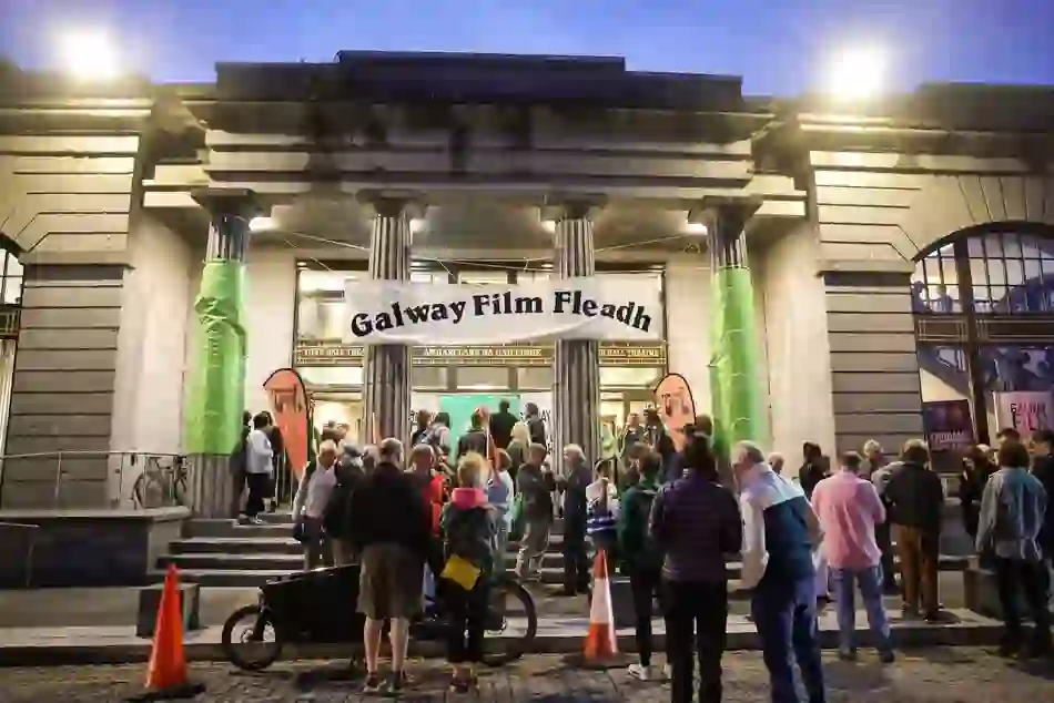 Evening crowd gathered outside the entrance of Galway Town Hall Theatre beneath a banner for the Galway Film Fleadh.