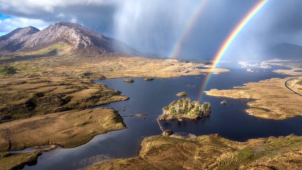 Double rainbow over Pine Island and the rugged lakes and mountains of Connemara, County Galway.