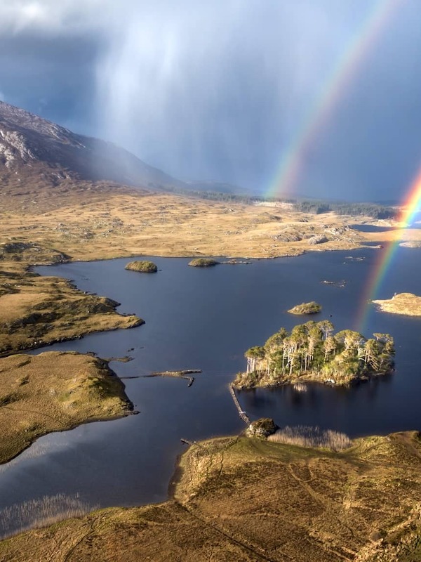 Double rainbow over Pine Island and the rugged lakes and mountains of Connemara, County Galway.