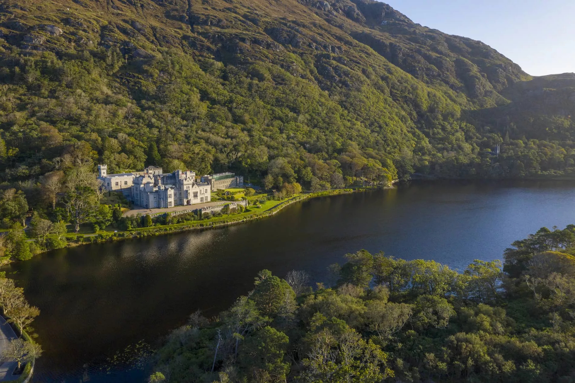 Kylemore Abbey on the shores of a wooded lake in Connemara, County Galway.