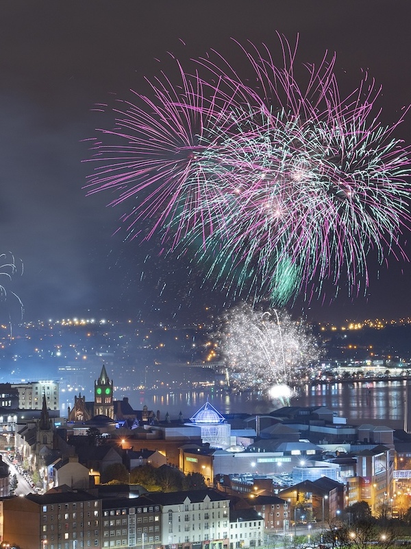 Colourful fireworks burst above Derry~Londonderry during Derry Halloween.