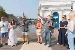 a group of people drinking coffee outdoors