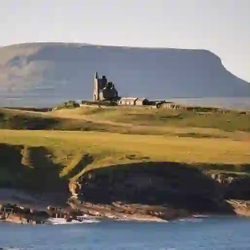 Classiebawn Castle on the Mullaghmore Peninsula, with Ben Bulben mountain in the background, County Sligo.