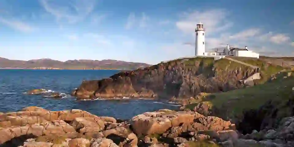 Fanad Head Lighthouse standing on rugged cliffs above the Atlantic in County Donegal, Ireland.
