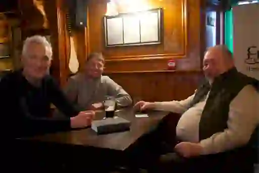 Martin and Roman Kemp chatting with a local in Friel’s Bar in Swatragh, County Londonderry.