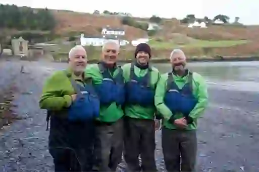 Martin and Roman Kemp with local guides on Glandore Bay beach in County Cork.