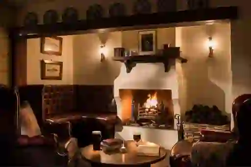 Leather armchairs, pints of Guinness and a roaring open fire in the traditional lounge of the Bushmills Inn, County Antrim.