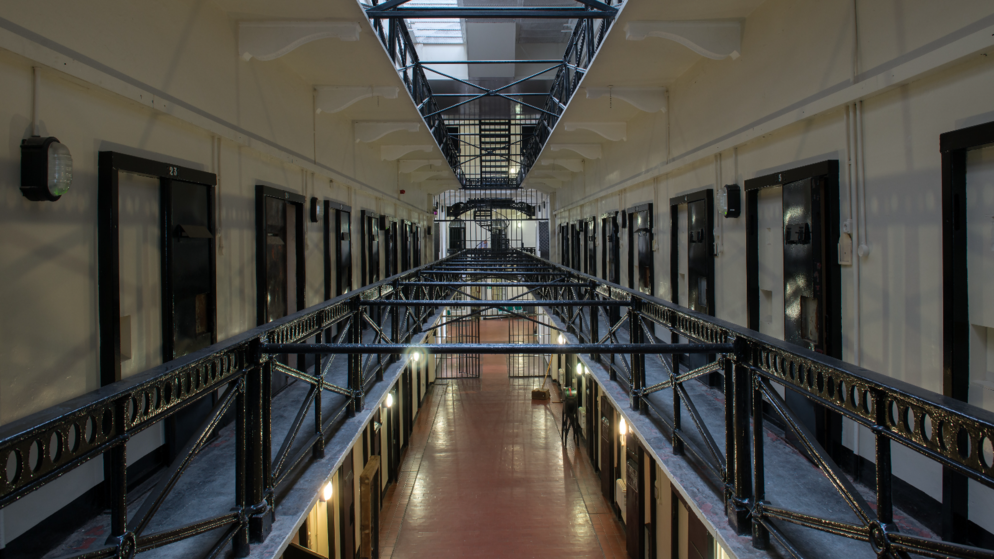 Victorian prison cell blocks and iron walkways inside Crumlin Road Gaol in Belfast.