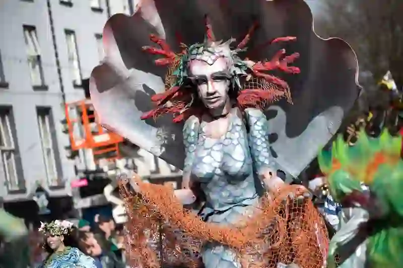 Sea-inspired parade performer with shell costume at Waterford’s St Patrick’s Day celebrations.