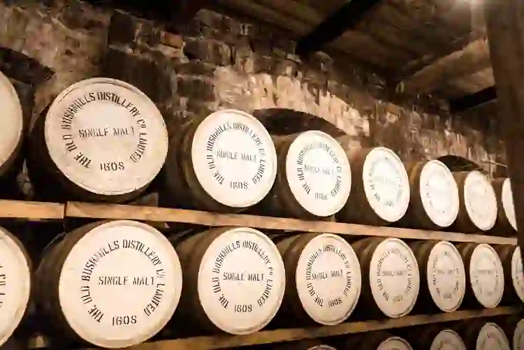 Rows of whiskey barrels ageing inside the Old Bushmills Distillery, Antrim.