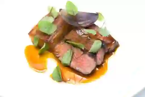 Grilled beef with vegetables, greens and rich sauce at Meat Locker in Belfast.