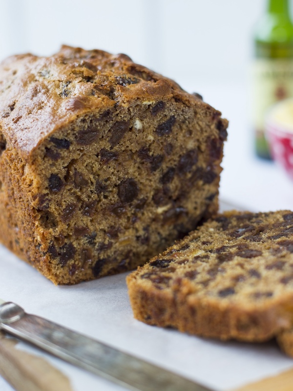 A traditional Irish barmbrack fruit loaf, sliced and ready to serve with butter.