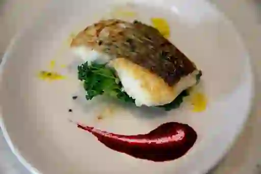 Pan-fried fish served on kale with beetroot purée at Dingle Cookery School, County Kerry.
