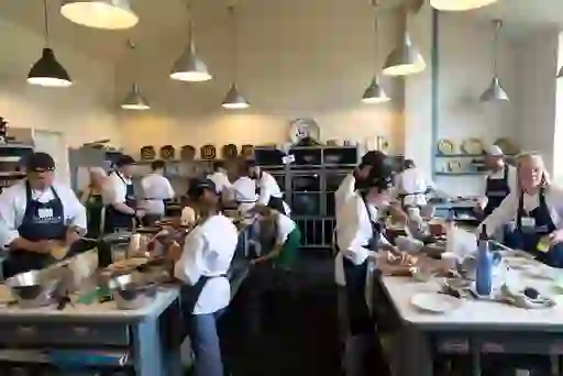 Students prepare dishes together in the busy kitchen at Ballymaloe Cookery School in County Cork.