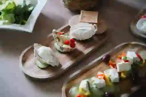 Buffalo mozzarella and salad dishes served on wooden boards during a Macroom Buffalo Farm tour in County Cork.