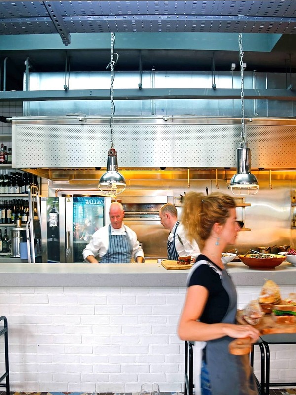 Open kitchen and restaurant team at The Woollen Mills in Dublin city centre.