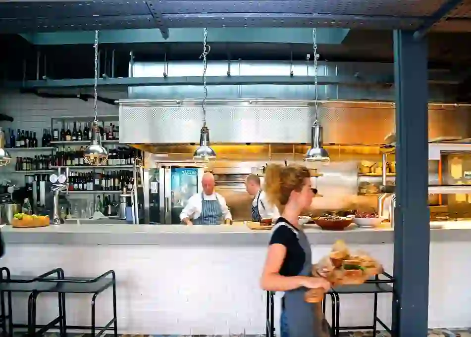 Open kitchen and restaurant team at The Woollen Mills in Dublin city centre.