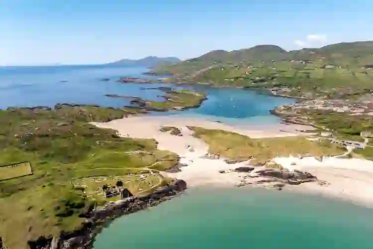 Aerial view of Derrynane Harbour and its sandy beaches on the scenic County Kerry coast.