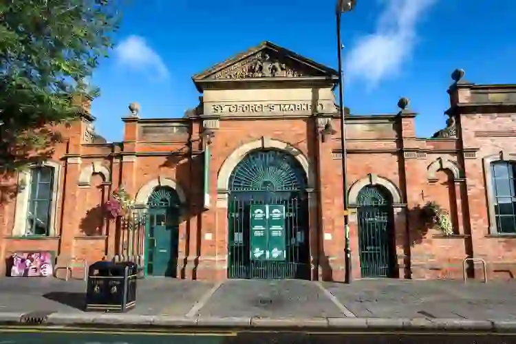 The red-brick façade and arched entrance of St George’s Market in Belfast.
