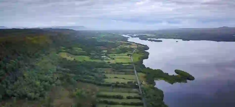 Aerial view of Magho Cliffs overlooking forest, farmland and Lower Lough Erne in County Fermanagh.
