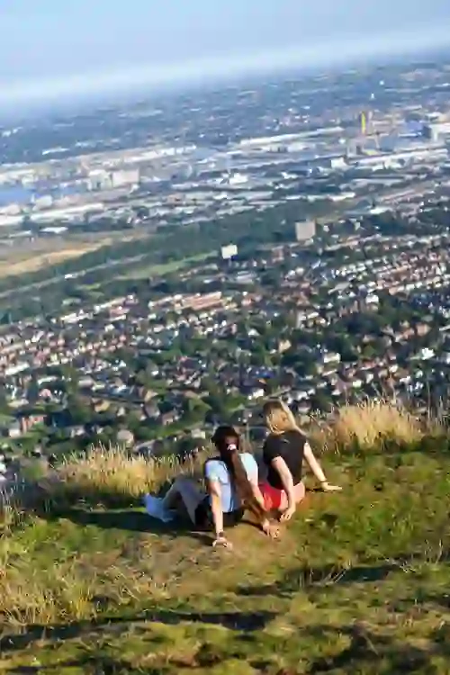 cavehillwalkingtour-girlsrelaxingonhill-portrait