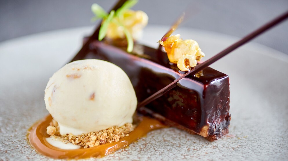 Gourmet dessert of chocolate cake with caramel popcorn and ice cream served in Donegal.
