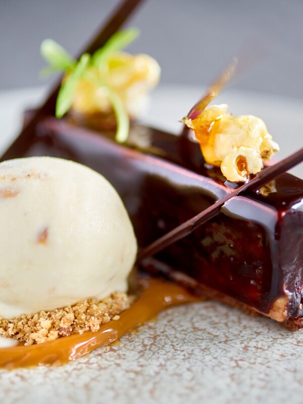 Gourmet dessert of chocolate cake with caramel popcorn and ice cream served in Donegal.