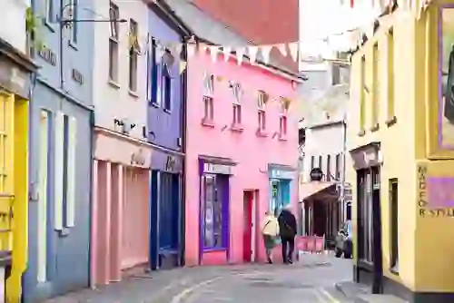 Colourful houses and bunting along a narrow street in Kinsale, County Cork, Ireland.