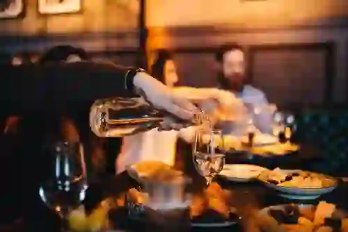 People enjoying drinks and food on a Cork food tasting tour.