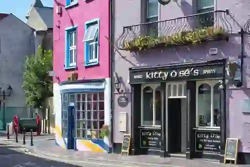 Colourful buildings and Kitty O’Sé’s pub on a street in Kinsale, County Cork.