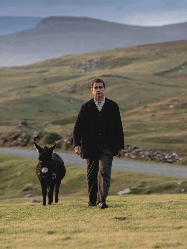 Colin Farrell walks a winding coastal road on Ireland’s Wild Atlantic Way in The Banshees of Inisherin.