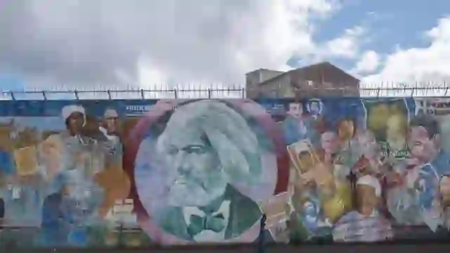 Mural of abolitionist Frederick Douglass and civil rights figures on a wall in Belfast, Northern Ireland.