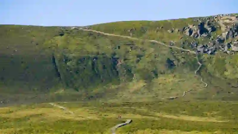 Cuilcagh Mountain boardwalk winding uphill across green moorland, County Fermanagh.