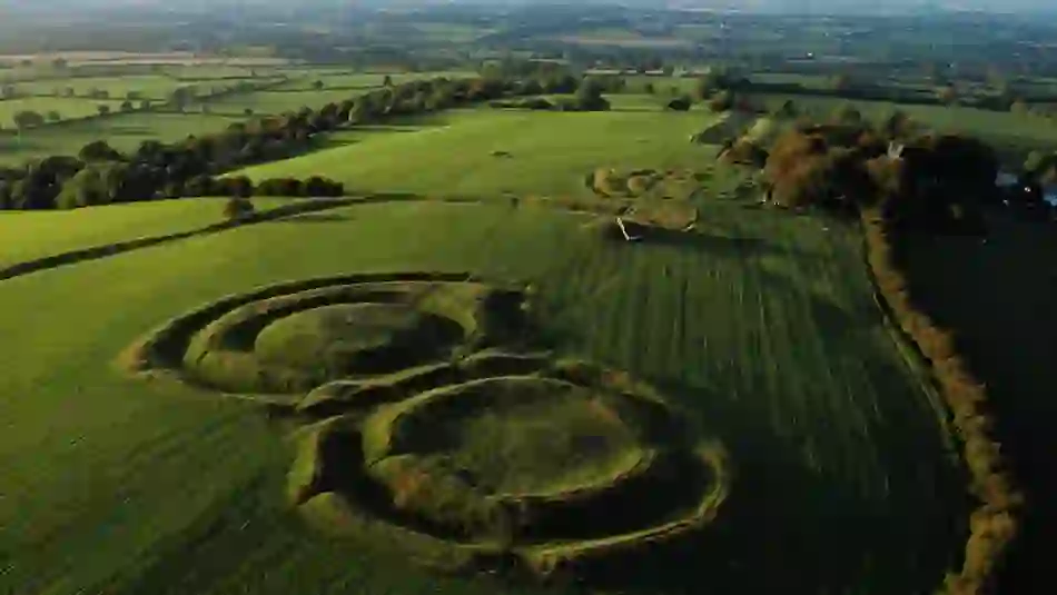 Aerial view of the Hill of Tara’s ancient ring forts and green pastures stretching across County Meath.