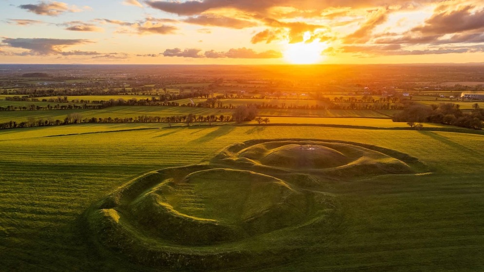 Sunrise over the ancient grassy earthworks at the Hill of Tara, County Meath.