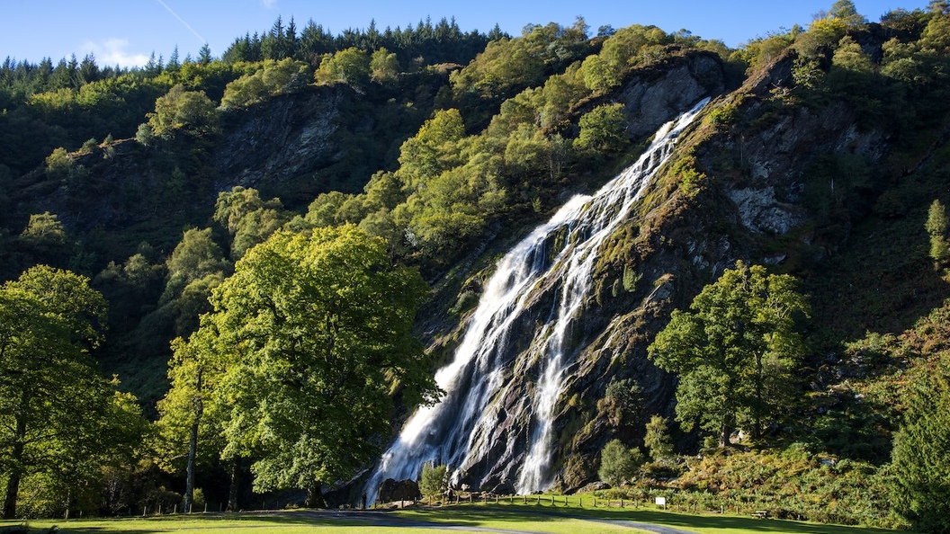 Powerscourt Waterfall cascading down forested cliffs in County Wicklow.