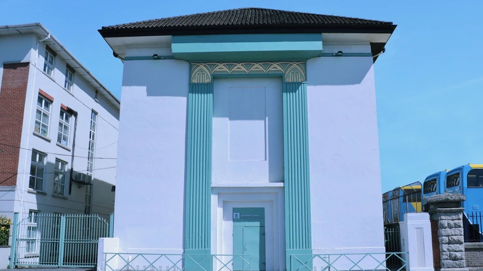 Exterior of Windmill Lane Recording Studios with teal accents and art deco design in Dublin city.