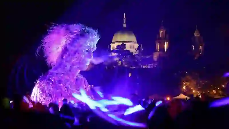 A giant illuminated figure moves through the crowd during a Macnas Halloween parade in Galway.