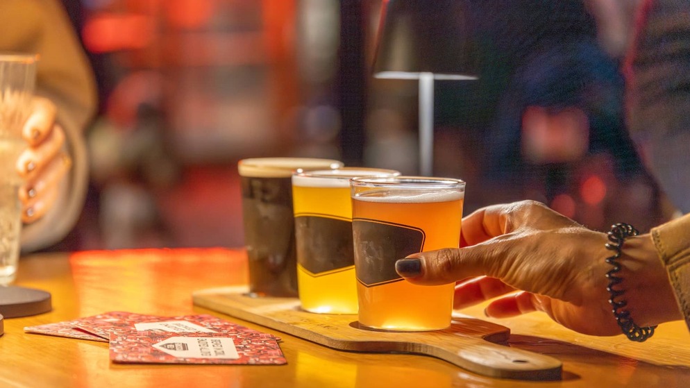 Beer tasting paddle at Franciscan Well Brewery, County Cork, featuring a selection of craft beers.