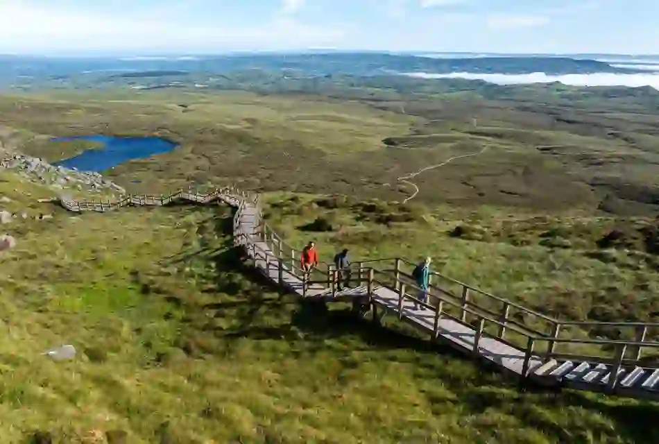 Walkers explore the Cuilcagh Boardwalk Trail amid sweeping upland scenery in County Fermanagh.