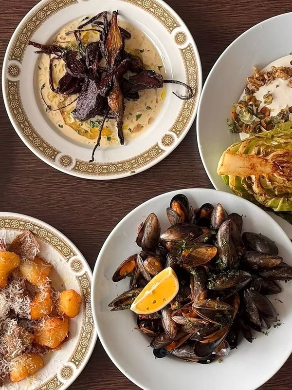 Sharing plates of seafood, pasta and seasonal vegetables at Misunderstood Heron, County Galway.